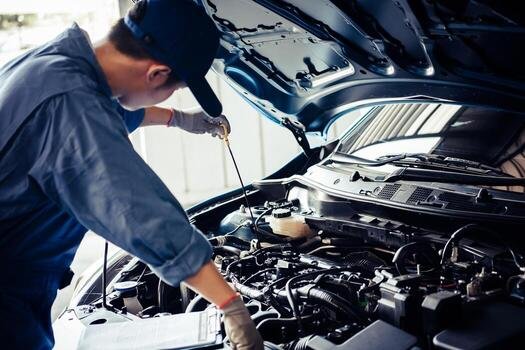 Technician completing a vehicle inspection at the test center